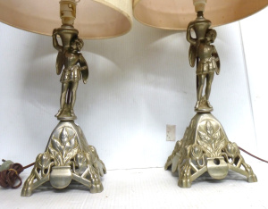 Lot 131 - Pair of ornate cast metal figural lamps - Courtier holding the lamp sh
