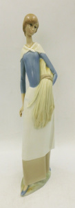 Lot 331 - Vintage Lladro Nao Spanish Porcelain figure of a girl carrying a sheat