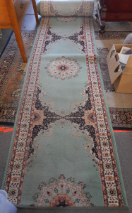 Lot 87 - Woolen Carpet Runner, traditional design in muted tones, 600x75cm
