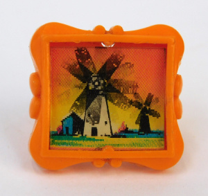 Lot 325 - R&L 1967 Cereal Toy Orange Flicker Ring featuring windmills