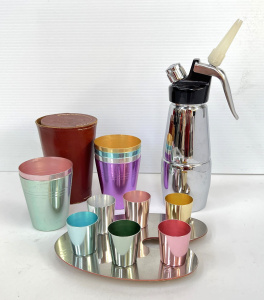 Lot 346 - Group - set 6 1950s Anodised harlequin shot cups on magnetised artist