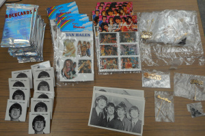 Lot 241 - Box lot Rock Stickers, Badges, and Cards, incl unopened packs 1991 roc