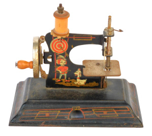 Lot 251 - Vintage Toy sewing machine, Casige No121 (Robin hood and dog), hand-po