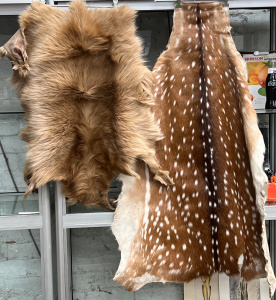 Lot 29 - 2 x hide skin rugs - Deer & long brown fur