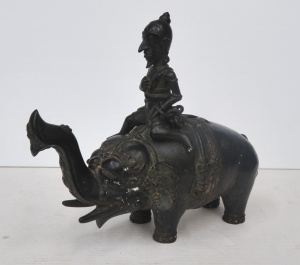 Lot 324 - Vintage Style Heavy Metal Eastern Figure of a man Riding an Elephant -