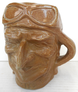 Lot 350 - Bendigo Pottery Novelty Character Jug of Sir Charles Kinsford Smith,