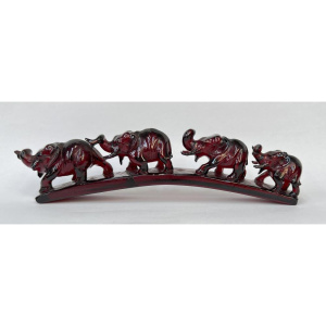 Lot 266 - Vintage red Amber carving of 4 elephants walking over incline - af 16