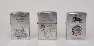 Lot 51 - 3 x Zippo Cigarette Lighters w Vietnam War Decorations to Fronts &