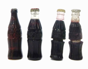 Lot 54 - 4 x Vintage Novelty Coca-Cola buddy bottle Cigarette Lighters - some wi