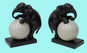 Lot 148 - Pair of Cast Metal Elephant Bookends - rolling a Ball - mounted on woo