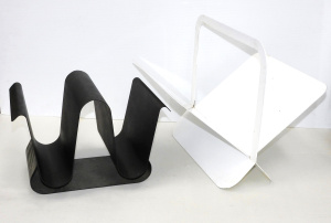 Lot 291 - 2 Metal Magazine Racks inc Modernist matt black wavy design & Whit