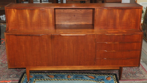 Lot 297 - 1970s Teak Sideboard by John Grimes w Two Drop down Shelves to Front -