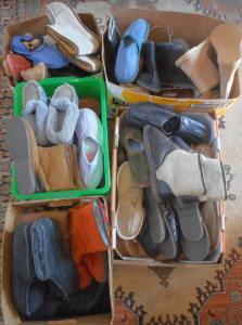 Lot 27 - 5 x Boxes as-new pairs of shoes - Ugg boots, moccasins, and slip-ons