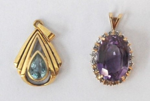 Lot 297 - 2 x 9ct gold pendants - oval Amethyst surrounded by small diamonds &am