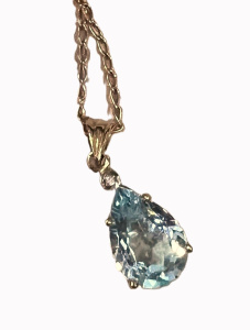 Lot 300 - 9ct gold chain with 9ct pendant set with blue Topaz and tiny dia - TW