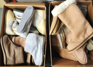 Lot 22 - 2 x Boxes as-new pairs of Ugg boots, moccasins & slip-ons
