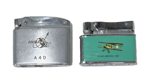 Lot 263 - 2 x vintage fuel Cigarette Lighters w Aviation themed design - 1916 De