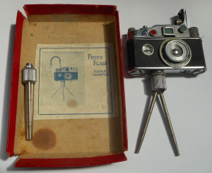 Lot 261 - Novelty Photo-Flash Cigarette lighter with in-built compass, in origin