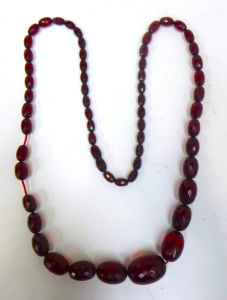 Lot 276 - Vintage faceted Cherry Amber necklace,