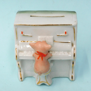 Lot 329 - Victorian German Porcelain Fairing Moneybox featuring a Pig Playing th