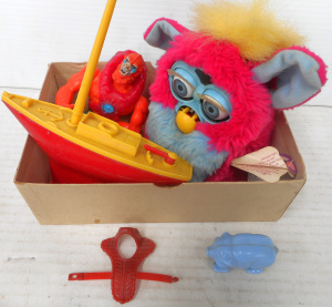 Lot 217 - Box Vintage toys incl a Furby, Cereal Toy, Master of the Universe acti