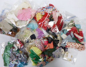 Lot 96 - Box lot of smaller sized Doll Clothes inc, Flower Fairies, dresses, pan