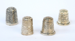 Lot 279 - 4 x Vintage sterling silver thimbles - varying patterns - marks sighte
