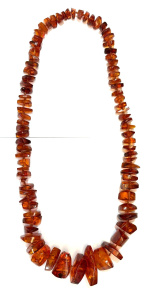 Lot 293 - 1930s long polished graduated Amber bead necklace - approx 70 cms L