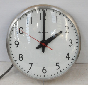 Lot 186 - Large Simplex electric wall clock 33cms D