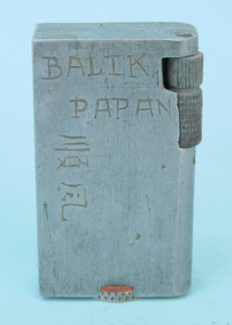 Lot 282 - Vintage Trench Art Aluminium Cigarette lighter Battle of Balik Papan