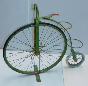 Lot 43 - Vintage metal penny farthing shaped double plant holder