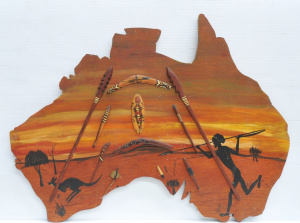 Lot 213 - Kitsch Wooden map of Australia Wall hang w Aboriginal Weapon Decoratio