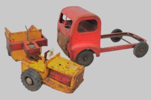 Lot 1 - 2 x vintage tin Toys - yellow & red Boomaroo Tournarocker tractor -