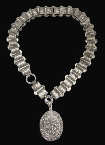 Lot 337 - c1900 Silver flat wide chain collarnecklace and oval locket with chast Lot 337 - c1900 Silver flat wide chain collarnecklace and oval locket with chast
