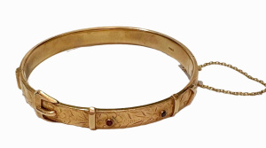 Lot 351 - Vintage 9ct ygold Buckle bangle set with two tiny red stones, London Lot 351 - Vintage 9ct ygold Buckle bangle set with two tiny red stones, London