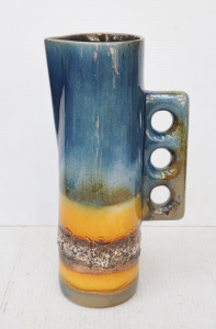 Lot 391 - Large Gunda MCM jug - cylinder shape with square handle, cut out holes Lot 391 - Large Gunda MCM jug - cylinder shape with square handle, cut out holes