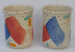 Lot 73 - Pair Guyroc 1980s style Brush Pots Vases - Hand painted Memphis style