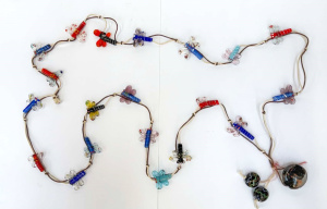 Lot 119 - Long necklace strung with Venetian glass Dragonfly shaped beads - few