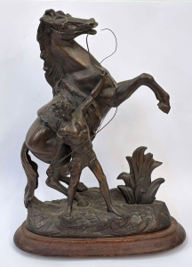 Spelter figurine on wooden plynth - man and rearing horse - approx 40cms H