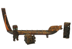 Lot 289 - Group lot - NZ Maori Items - Carved Wooden Longboat 67cm L, Small Hous