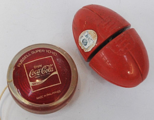 Lot 133 - 2 x Vintage toy Yo-Yo's incl Coca-Cola Russels Yo-Yo & AFL Sherrin