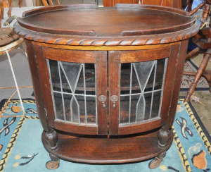 Lot 69 - 1930s Oak Tudor Style Auto Trolley w Typical lead Light Doors to Front