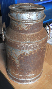 Lot 38 - Large vintage Malleys Lidded Metal Milk Cannister - raised lettering ar