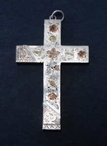 Lot 146 - Sterling silver Crucifix with raised & engraved floral pattern TW