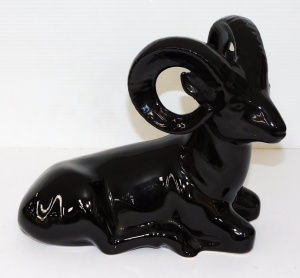 Lot 190 - Black Glazed Ceramic seated Ram figure - unmarked 22cm H Lot 190 - Black Glazed Ceramic seated Ram figure - unmarked 22cm H