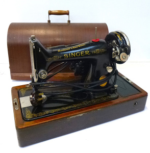Lot 63 - Circa 1930s Singer Electric Sewing Machine with knee lever in original