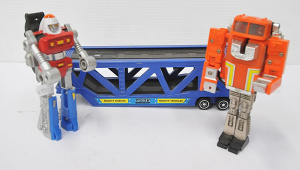 Lot 128 - 2 x vintage Large sized Machine Men Super Gobots - Stacks w Car carri