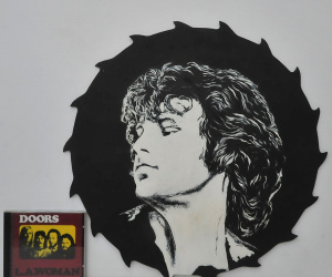 Lot 144 - 2 pieces - The Doors LA Woman CD & Painted Saw Blade w Image of Ji