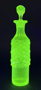 Lot 230 - Vintage Uranium Citrine glass bottle with upper pinwheel pattern &