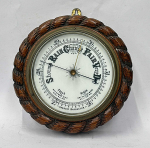 Lot 98 - c1900s Aneroid Wall barometer - Carved wooden case with rope design - e